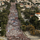 People march to Revolution Square in Havana to celebrate May Day, on May 1, 2018